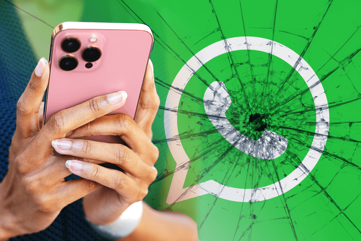 hands holding iphone with whatsapp logo