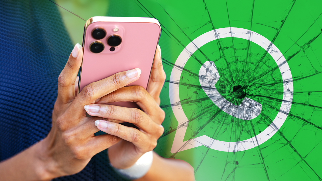 hands holding iphone with whatsapp logo