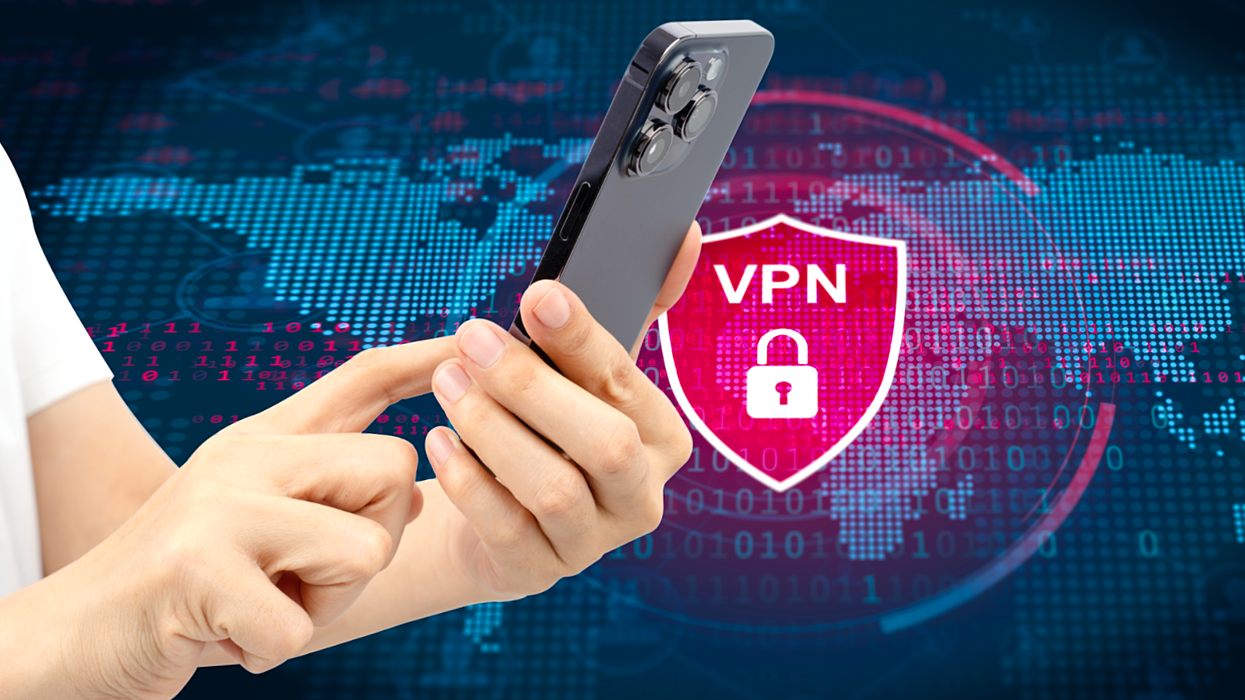 hands holding mobile phone with vpn logo over the globe in the background