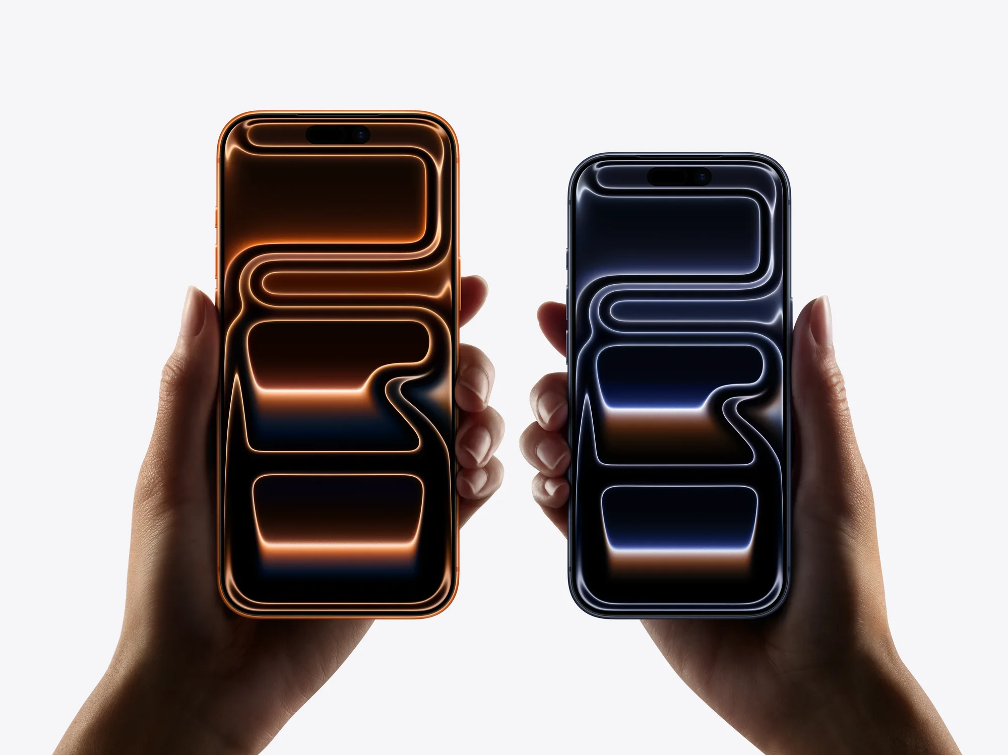 hands holding the iPhone 17 Pro Max and iPhone 17 pro at the same time