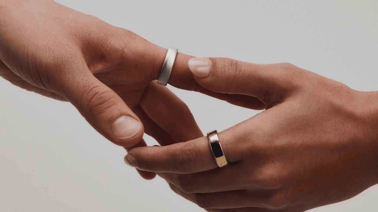 Hands wearing Oura Ring 5