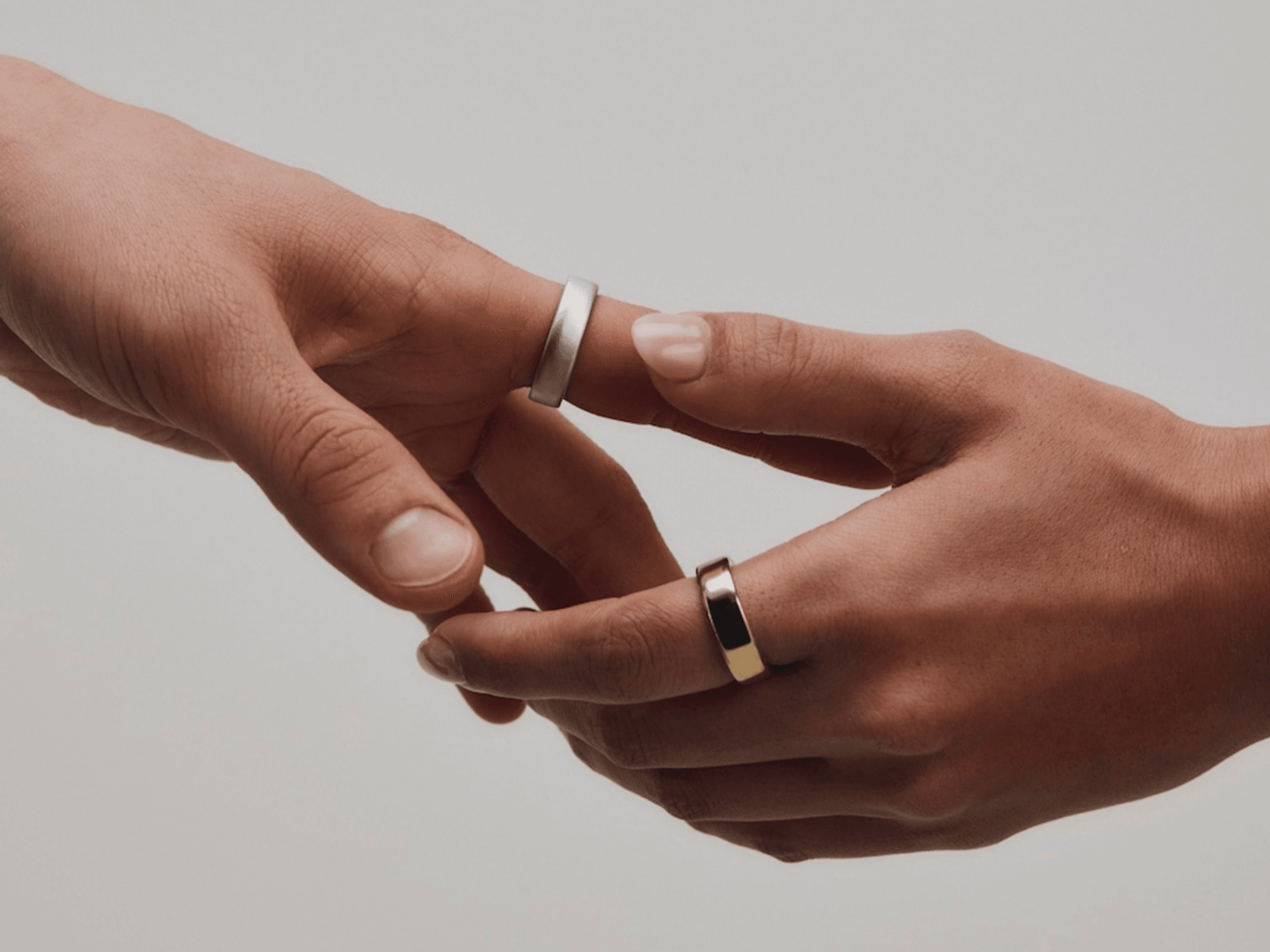 Hands wearing Oura Ring 5