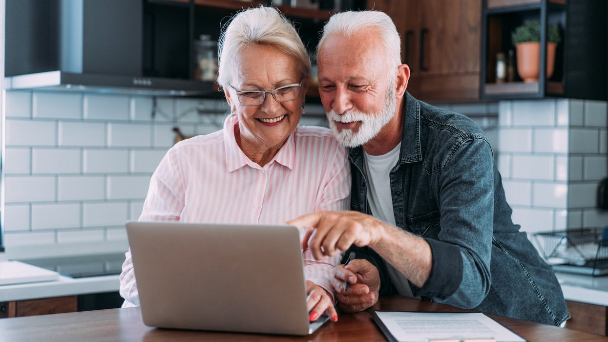 Happy couple at laptop