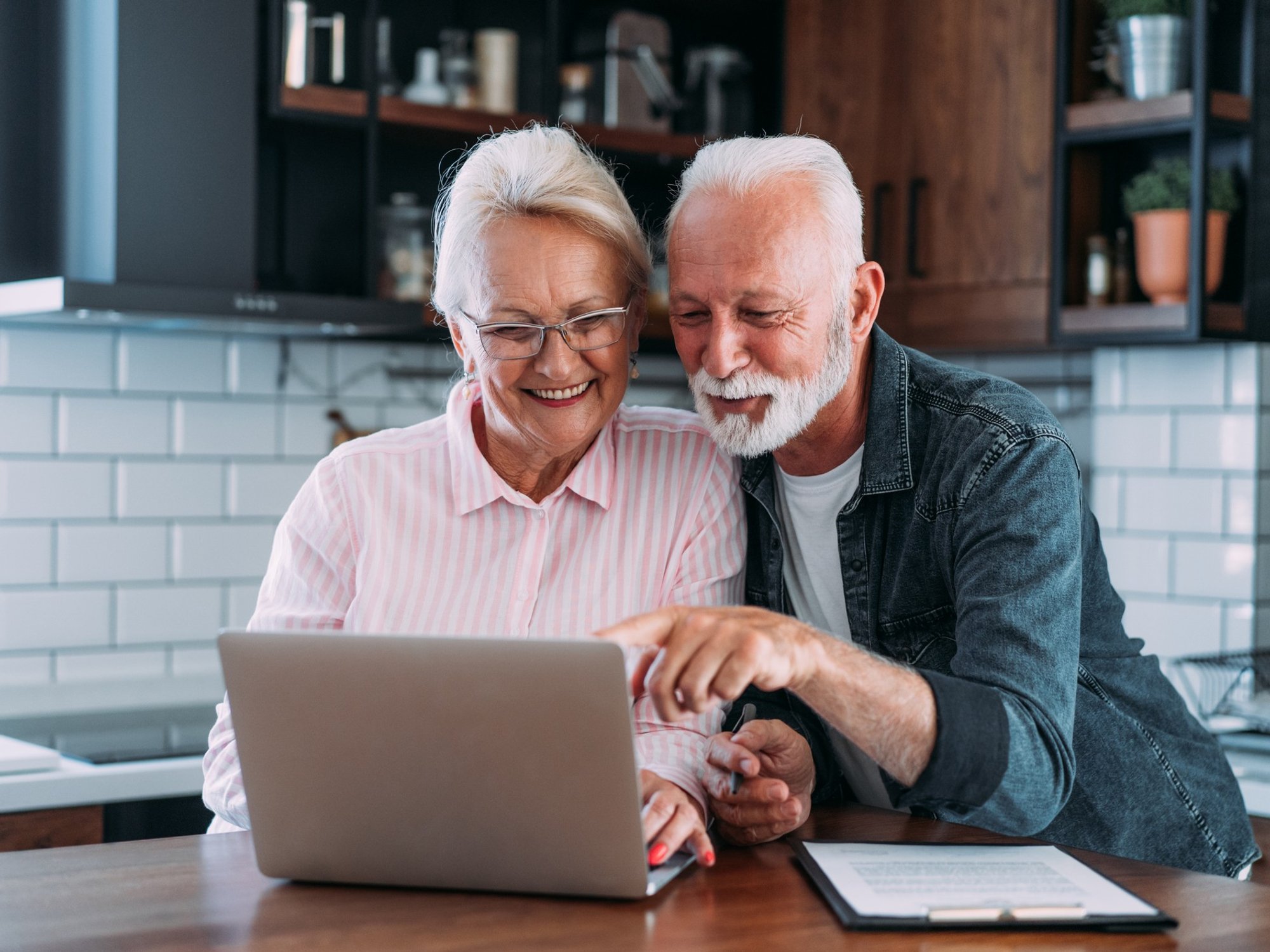 Happy couple at laptop
