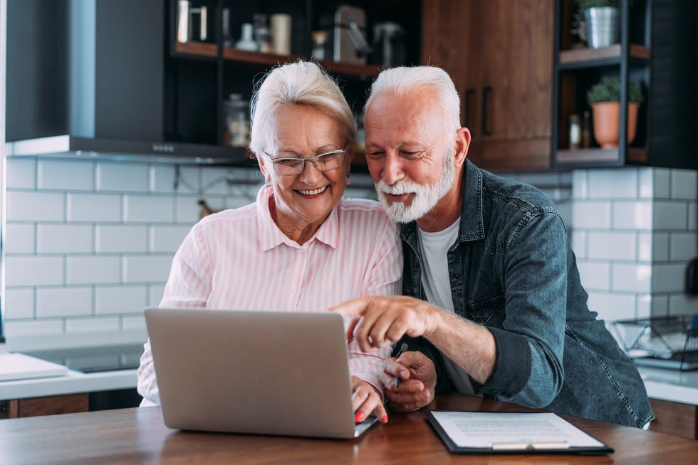 Happy couple at laptop