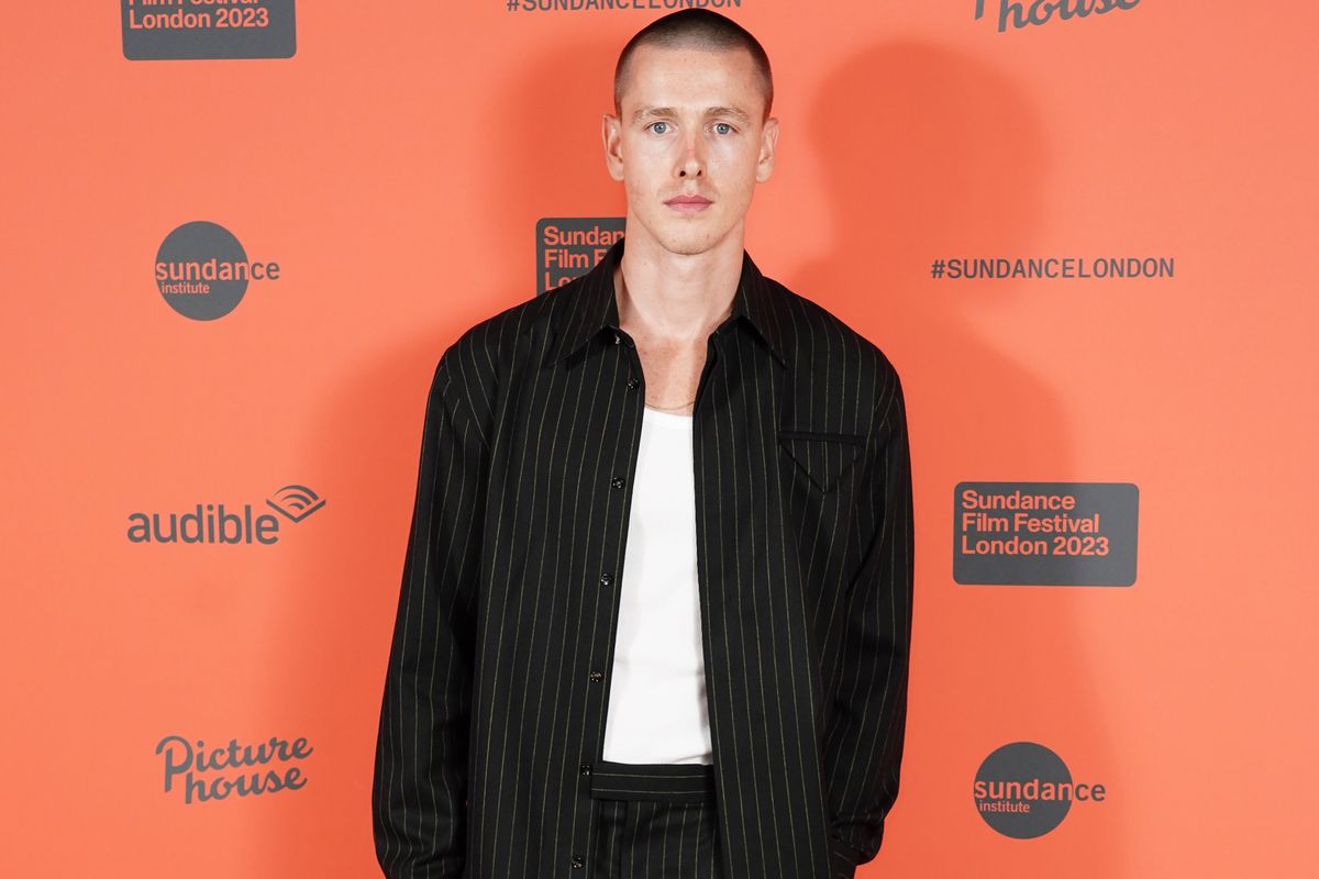 Harris Dickinson orange background