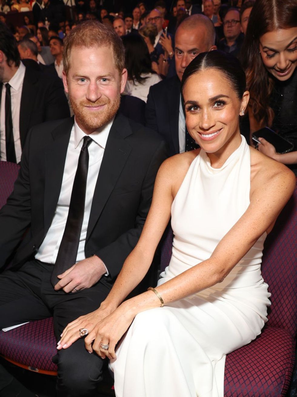Harry and Meghan smiling