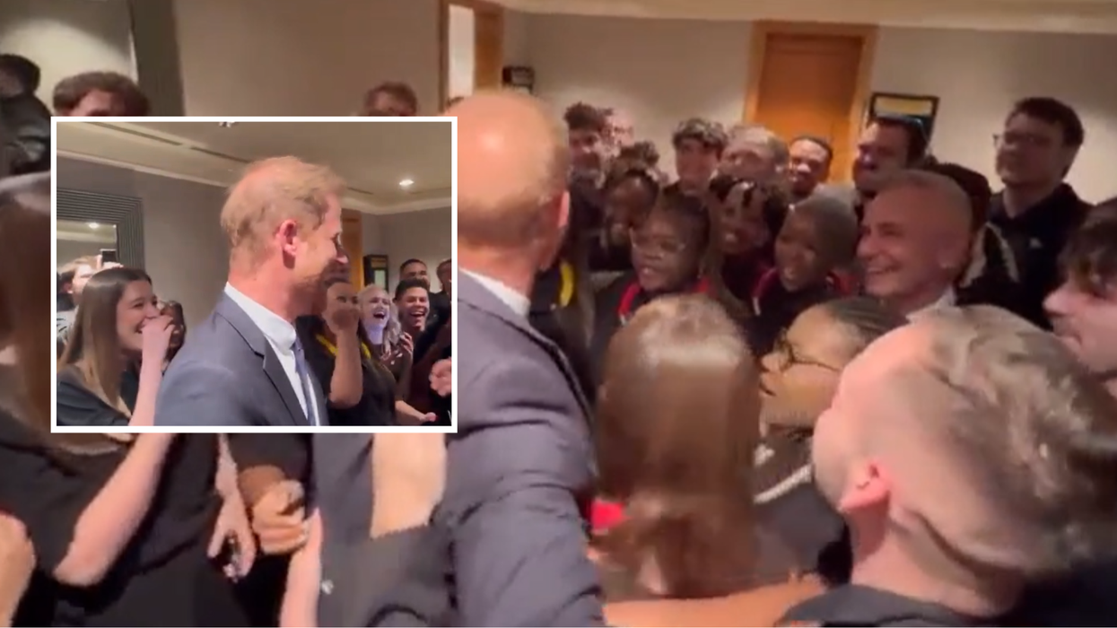 Harry and the choir members all share a massive hug together