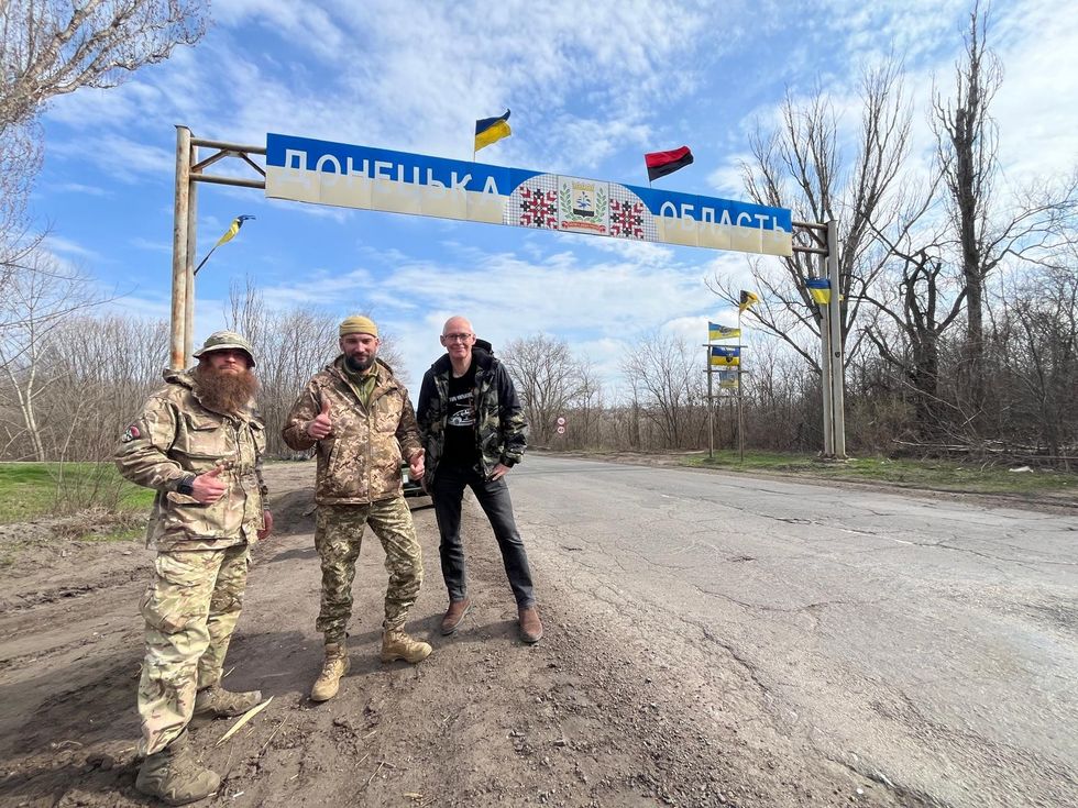 Hawkins at the sign for the Donetsk region