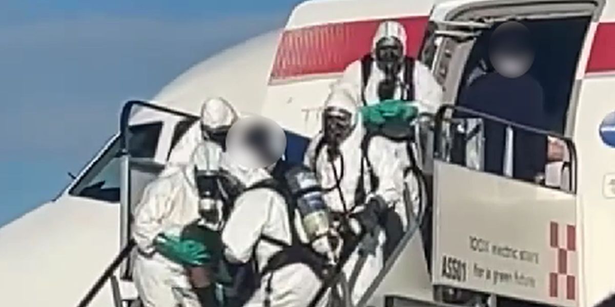 NextImg:British Airways flight forced into emergency landing after cabin crew collapse on board due to 'toxic fumes' as hazmat suits rush to the scene