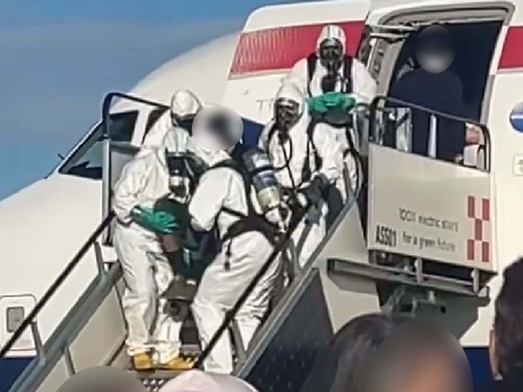 Hazmat crews boarded the plane once it touched down in Italy