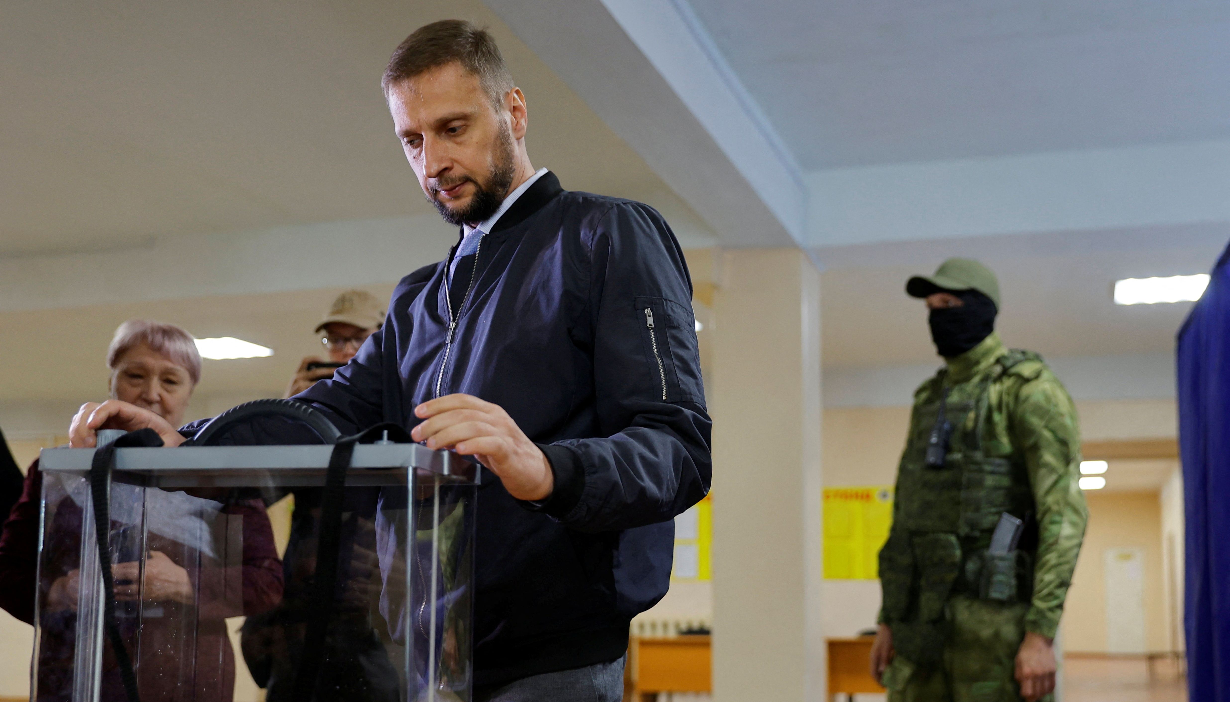 Head of the central electoral commission of the self-proclaimed Donetsk people's republic Vladimir Vysotsky visits a polling station ahead of the planned referendum on the joining of the Donetsk people's republic to Russia, in Donetsk, Ukraine