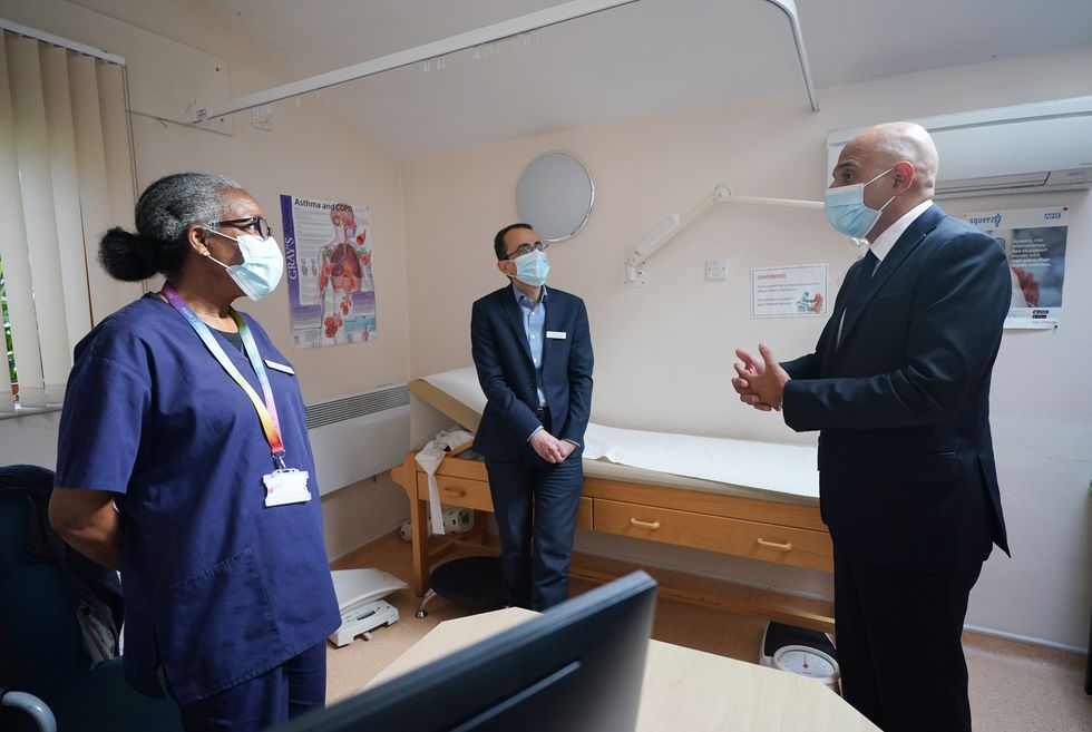 Health Secretary Sajid Javid meeting Dr Clementine Olenga-Disashi (left) and Dr Ali al-Bassam, during a visit to the Vale Medical Centre in Forest Hill, south east London, following the announcement of the blueprint for improving access to GP appointments and supporting GPs and their teams. Picture date: Thursday October 14, 2021.