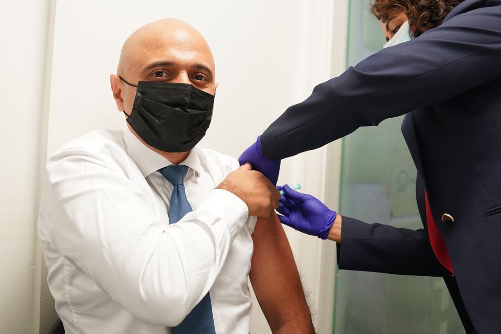 Health Secretary Sajid Javid receives his Covid-19 booster jab from Nikki Kanani, Medical director primary care NHS England, at a pharmacy in central London.