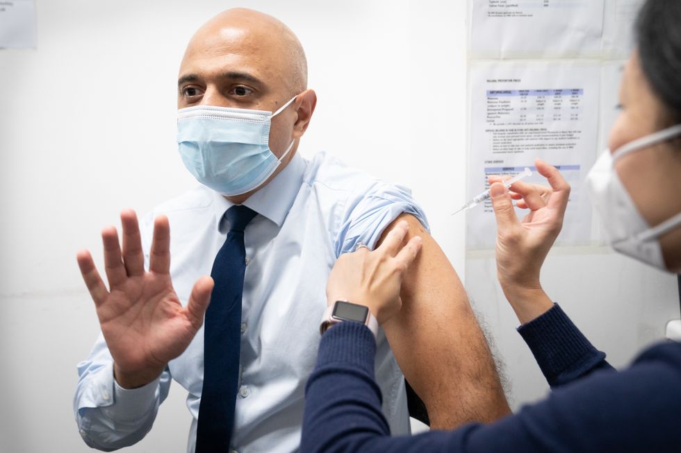 Health Secretary Sajid Javid receives his flu vaccine at a pharmacy in Westminster, London.