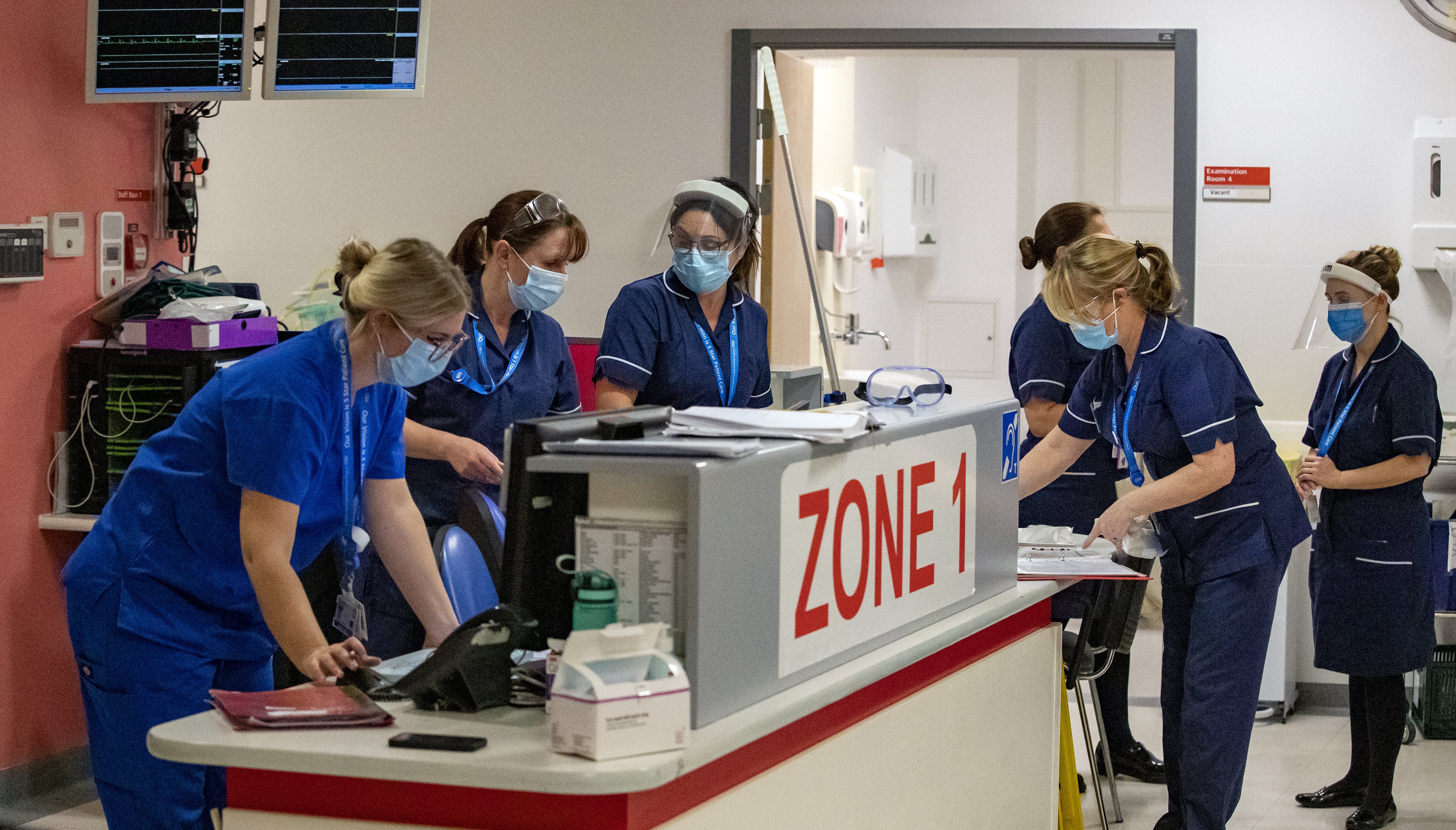 Health workers in the accident and emergency (A&E) department at Whiston Hospital in Merseyside.