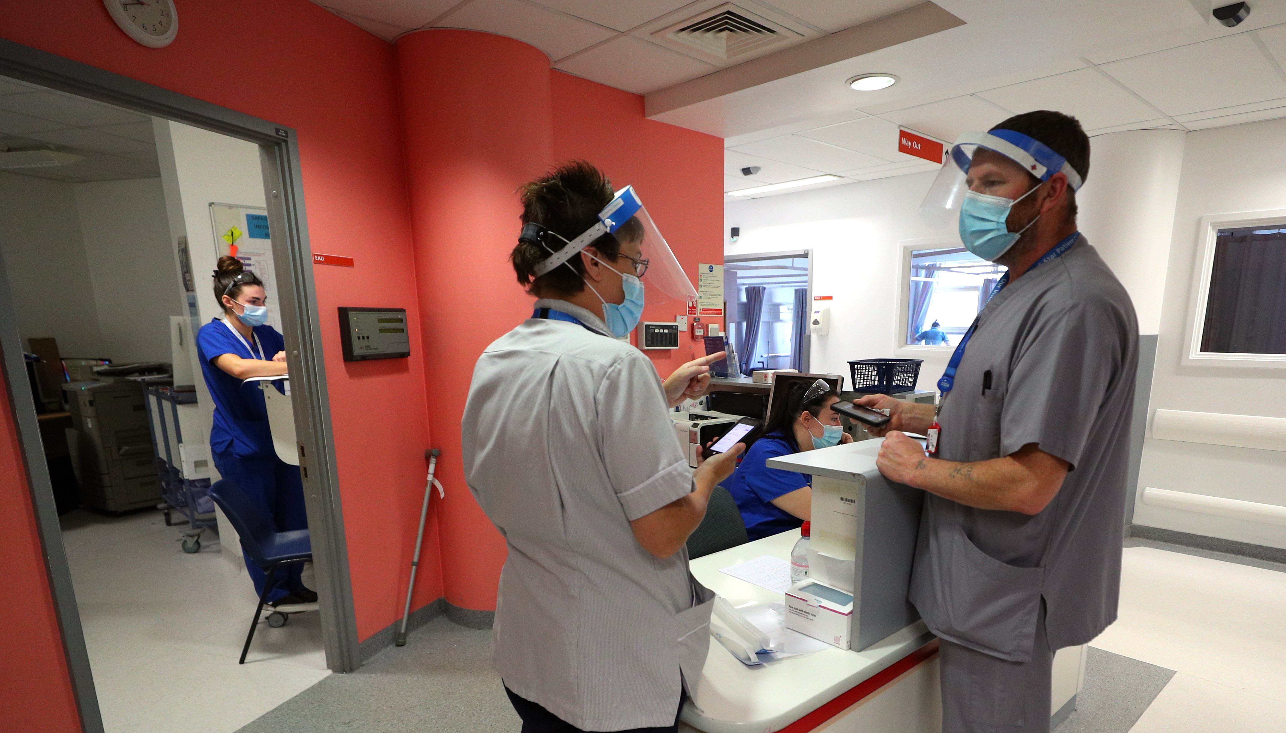 Health workers in the accident and emergency (A&E) department at Whiston Hospital.