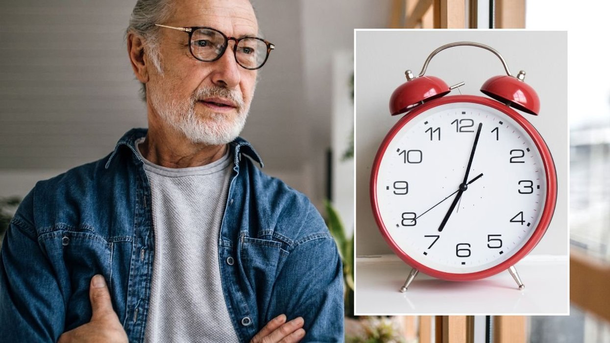 HEALTHY SENIOR MAN LOOKING OUT WINDOW