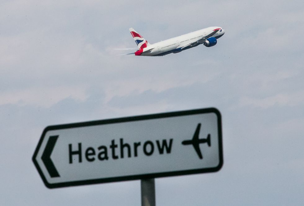 Heathrow sign and plane in sky