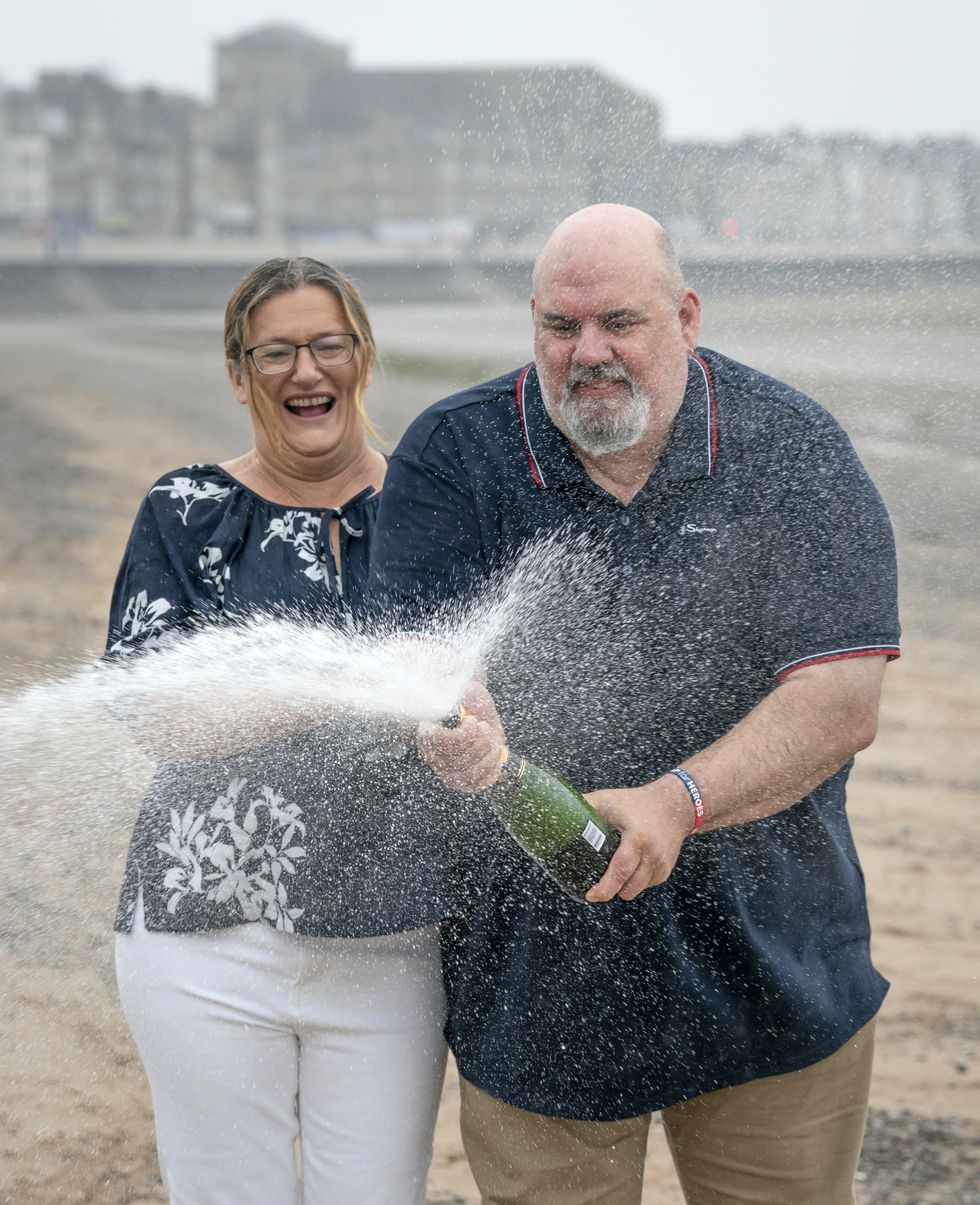 Helen and Lee Kuchczynski, from Cumbria, during a photo call to celebrate their 3.6 million EuroMillions win, in Morecambe, Lancashire. Picture date: Friday July 22, 2022.