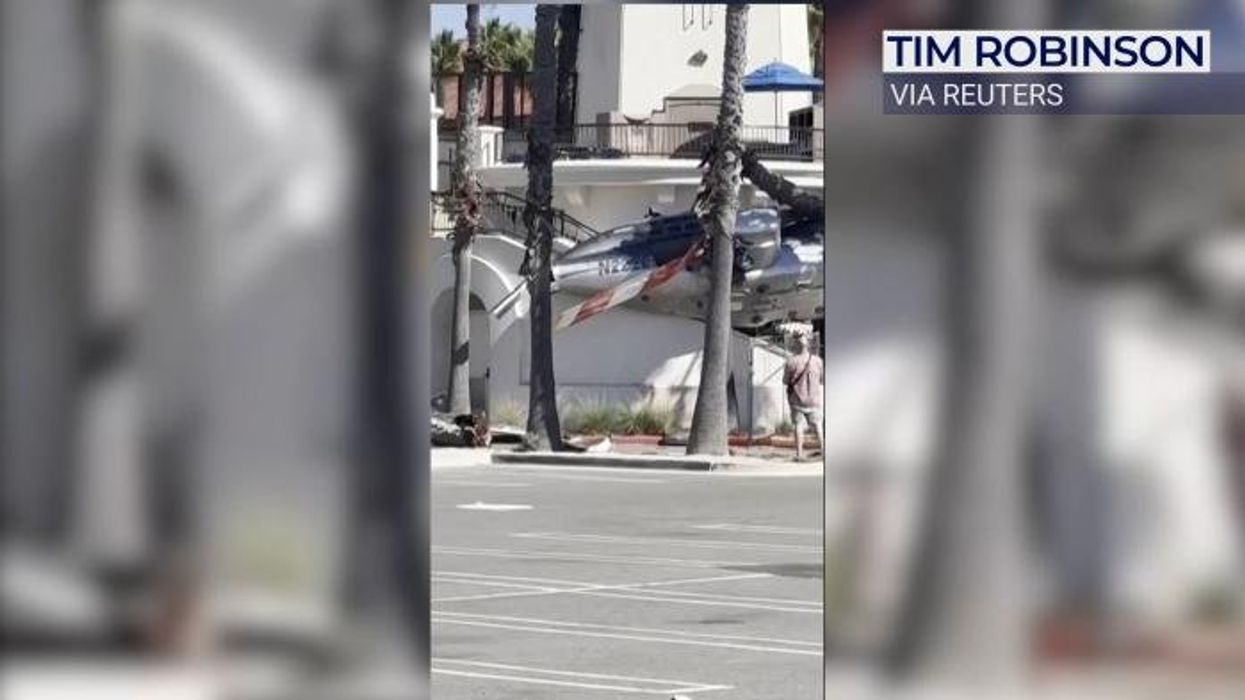 Helicopter crashes into beachgoers after spinning out of control leaving five people hospitalised
