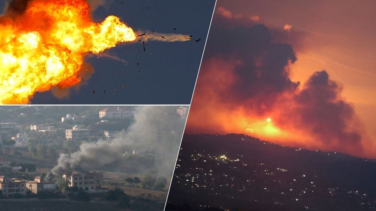 Israel strikes Lebanon after Hezbollah launches hundreds of rockets in major Middle East escalation