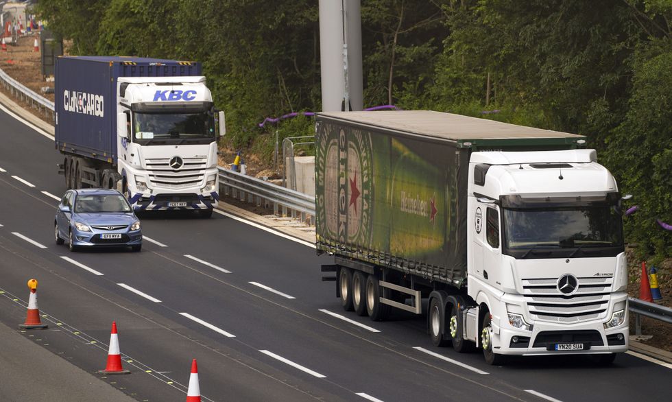 HGV lorries on the M4 motorway near Datchet, Berkshire.