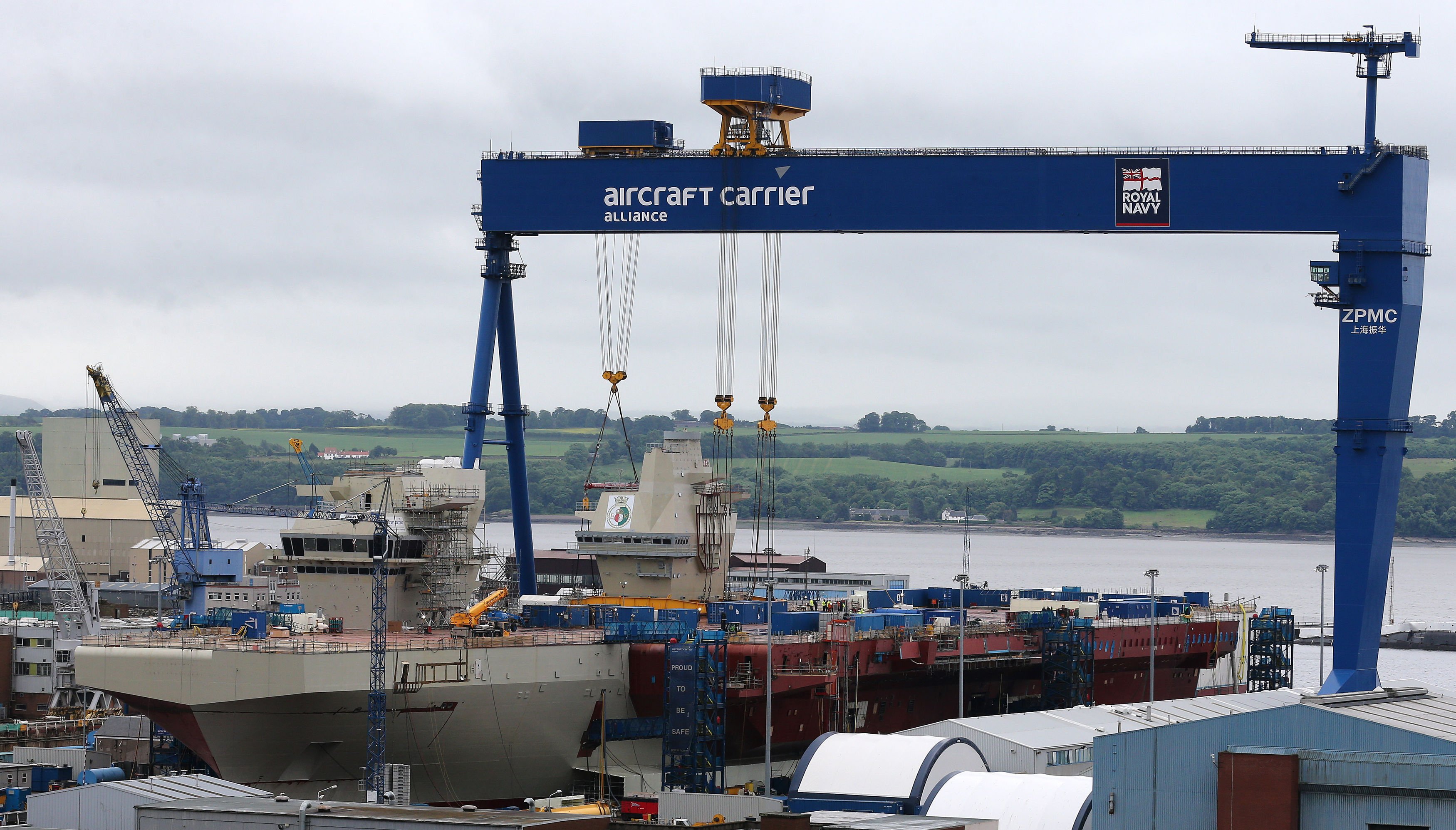 HMS Queen Elizabeth at Babcocks Rosyth Dockyard as a plaque with the emblems of the Royal Navy in 2013.