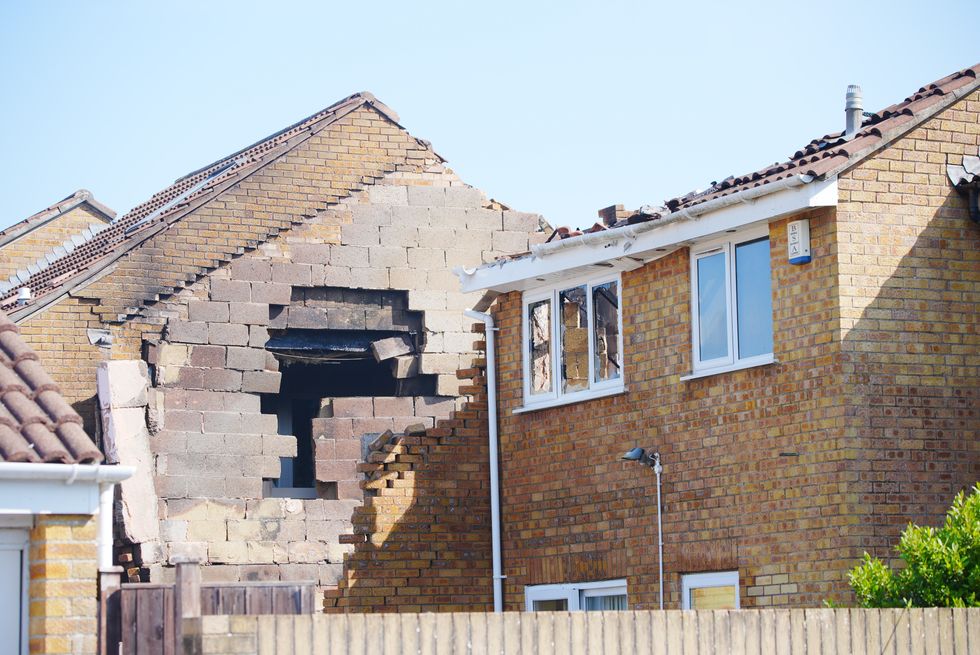 Hole in wall of home next door