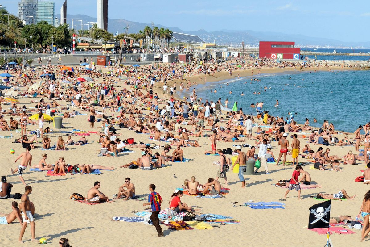 Holidaymakers on a beach in Spain