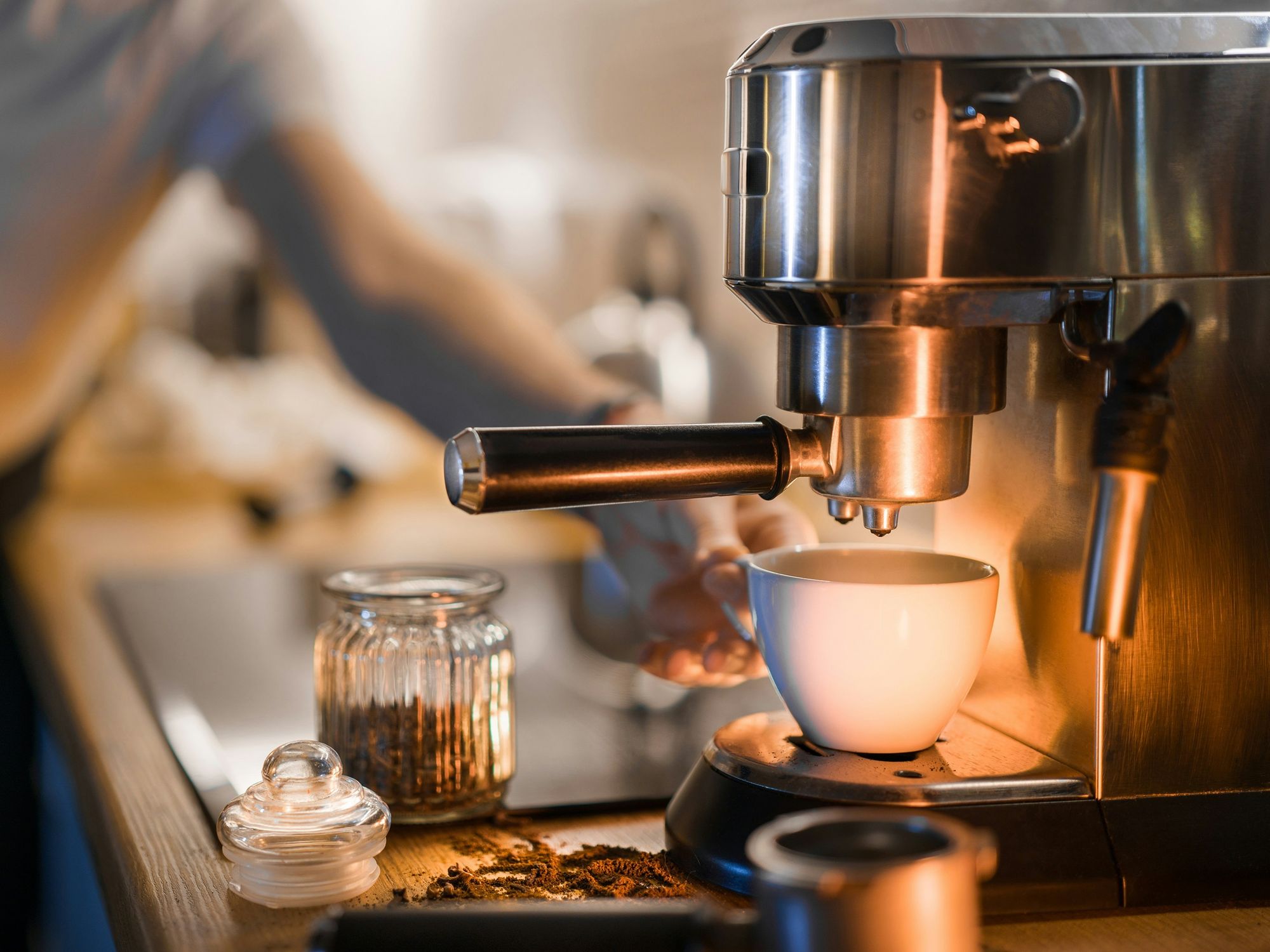 Home coffee machine brewing a cup of coffee
