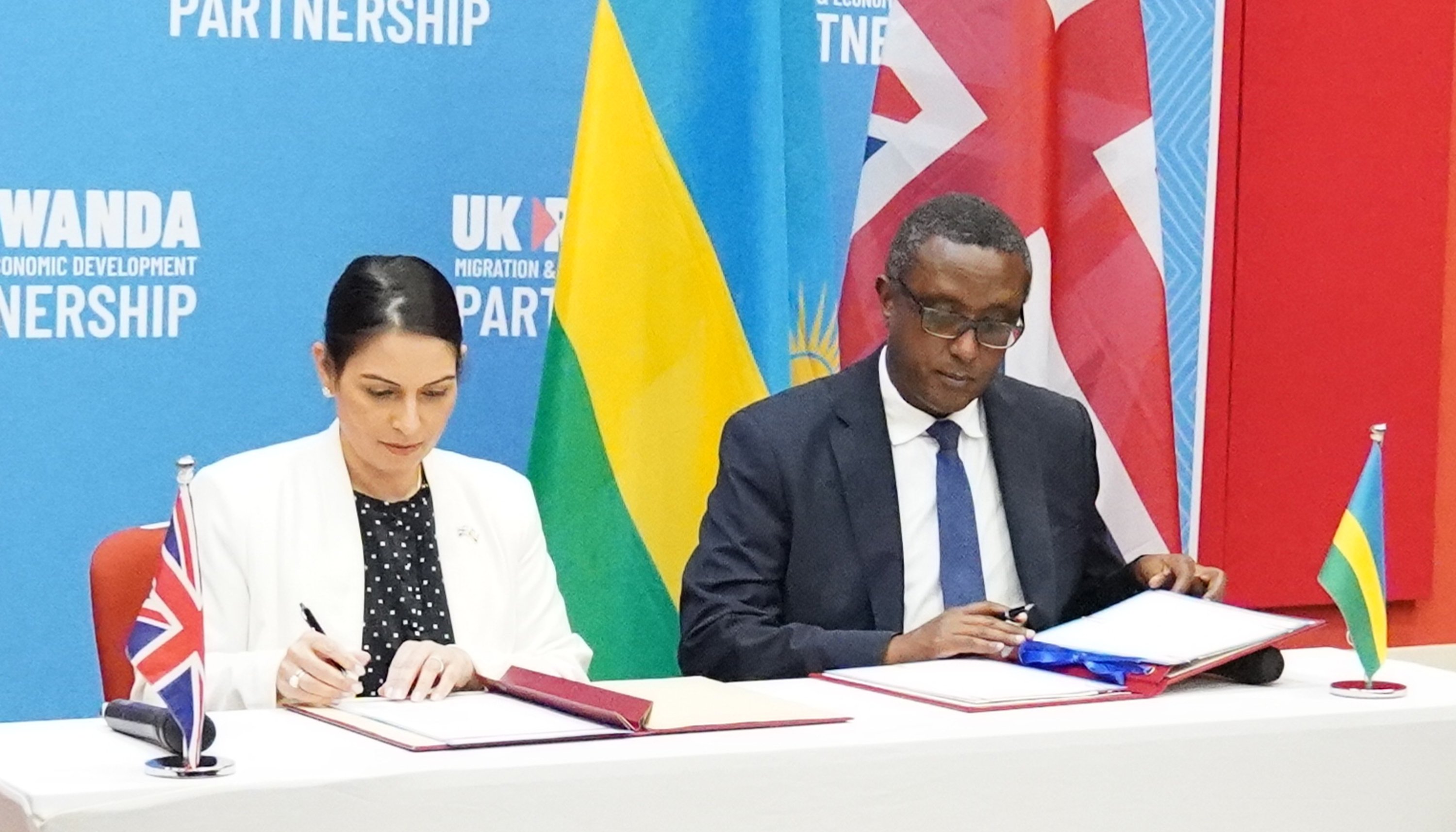 Home Secretary Priti Patel and Rwandan minister for foreign affairs and international co-pperation, Vincent Biruta, signed a %22world-first%22 migration and economic development partnership in the East African nation's capital city Kigali, on Thursday.