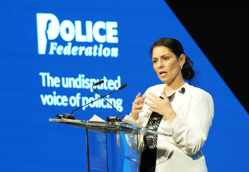 Home Secretary Priti Patel speaking at the annual conference of the Police Federation of England and Wales at the Central Convention Complex in Manchester. Picture date: Tuesday May 17, 2022.