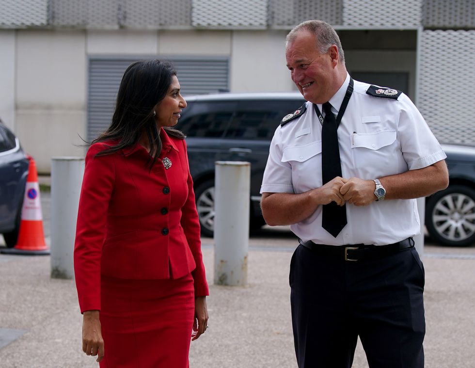 Home Secretary Suella Braverman (left) is met by Chief Constable of Greater Manchester Police Stephen Watson during a visit to Greater Manchester Police HQ in Manchester