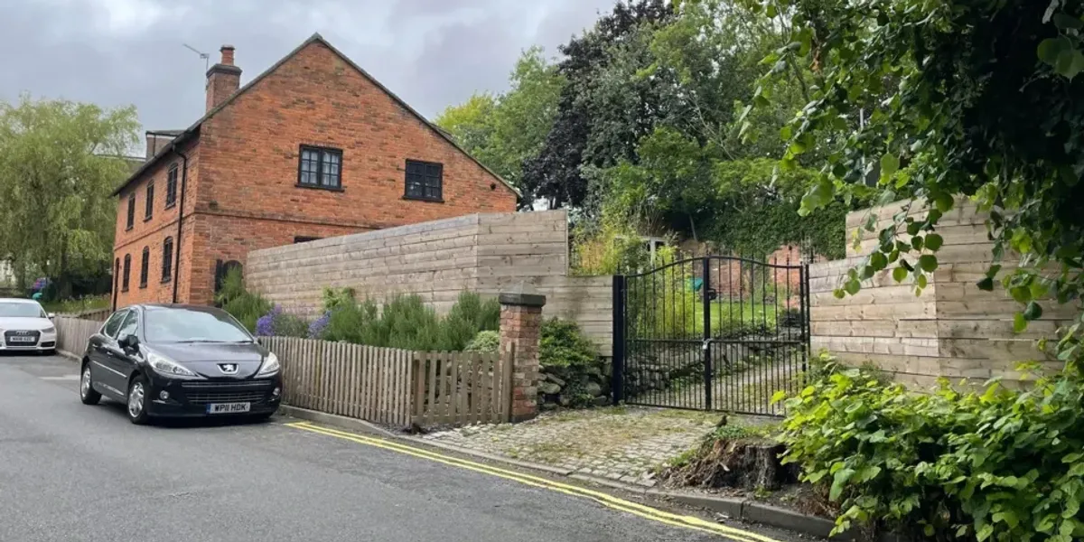 NextImg:Homeowner ordered to demolish 2m fence put up without planning permission.... but neighbours LOVE it