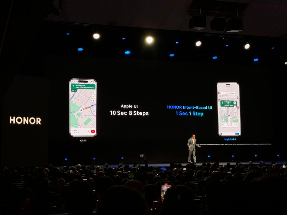 honor ceo george zhao pictured on stage at the mwc tradeshow comparing his magic 6 pro phone against apple