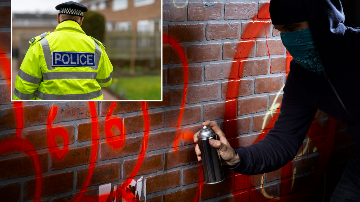 Hooded figure graffiti/police