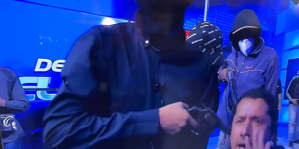 NextImg:Horror moment armed gunmen storm Ecuador TV station and hold staff at gunpoint