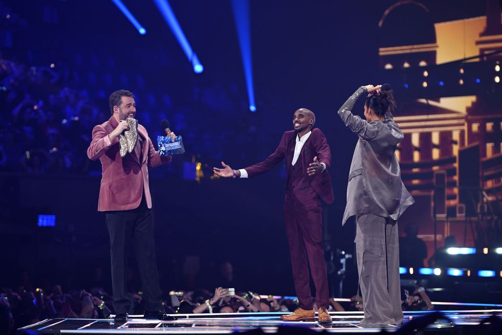 Hosts Jason Manford, Alesha Dixon and Sir Mo Farah onstage during The National Lottery's Big Bash to celebrate 2023