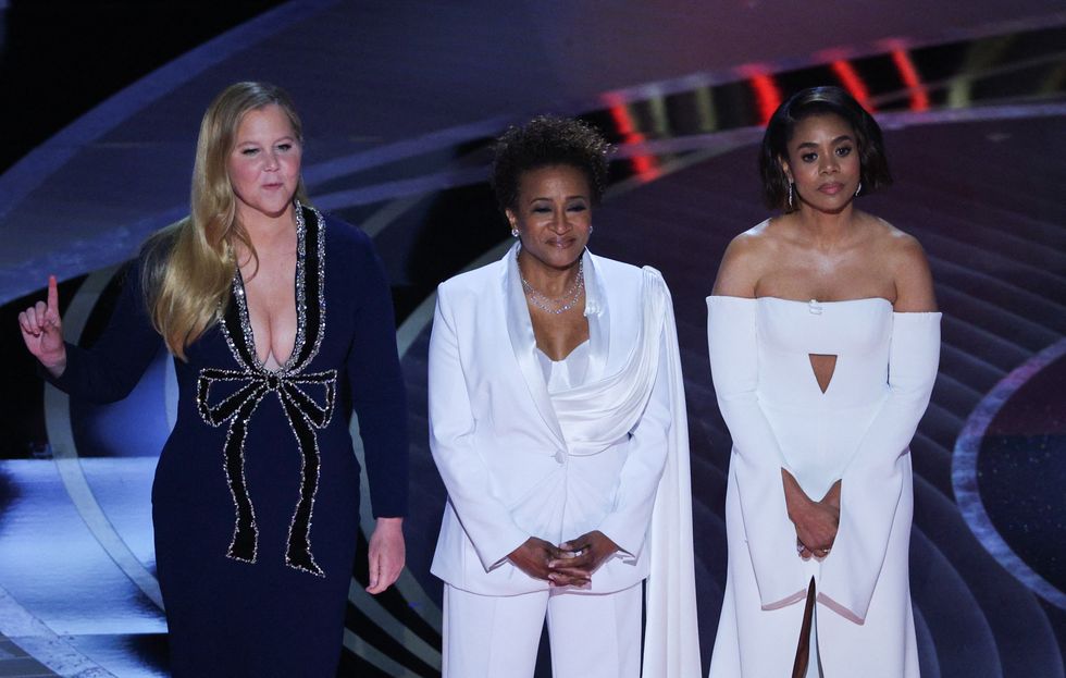 Hosts Regina Hall, Amy Schumer and Wanda Sykes speak to the audience at the 94th Academy Awards in Hollywood, Los Angeles, California, U.S., March 27, 2022. REUTERS/Brian Snyder
