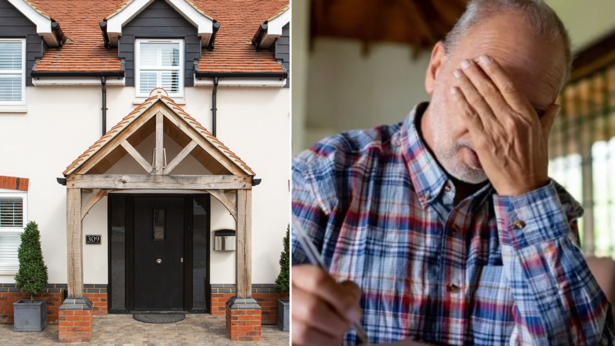 House / man with head in hands