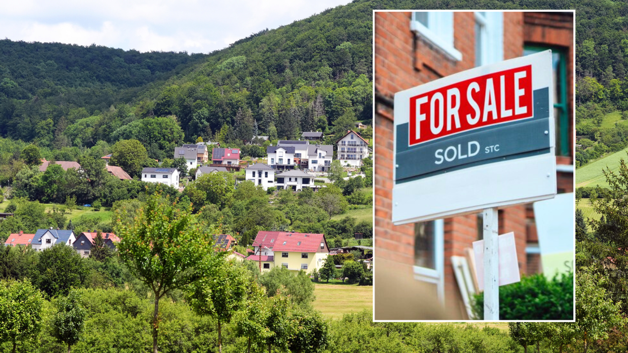 Houses in countryside / for sale sign