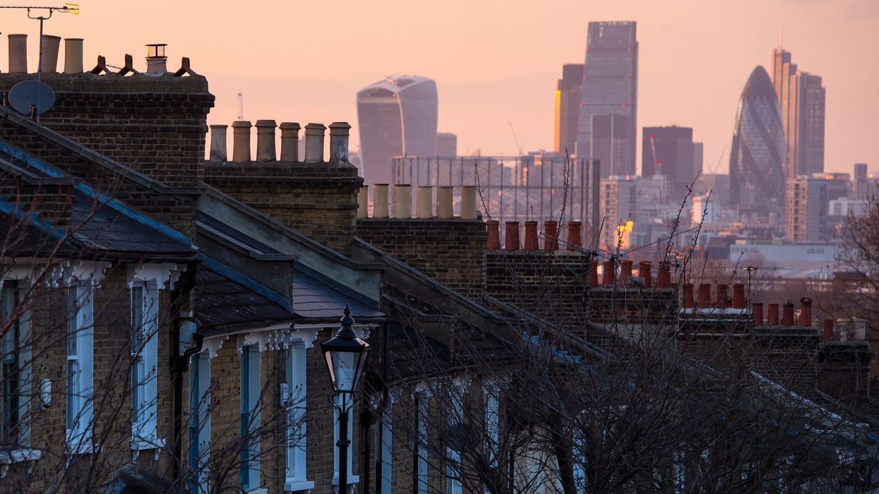 Houses with city in the background