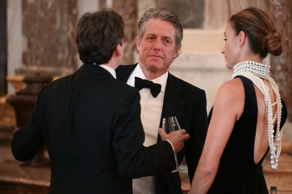 Hugh Grant and his wife mingled