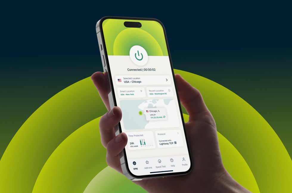 human hand pictured holding an iphone with the ExpressVPN app running on-screen