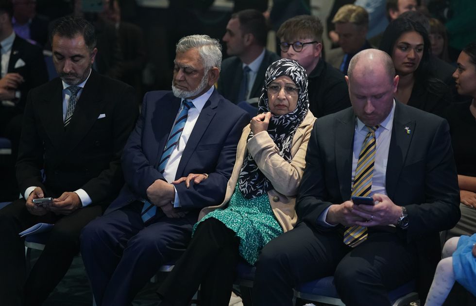 Humza Yousaf's parents (centre) Muzaffar Yousaf (father) and Shaaista Bhutta (mother).