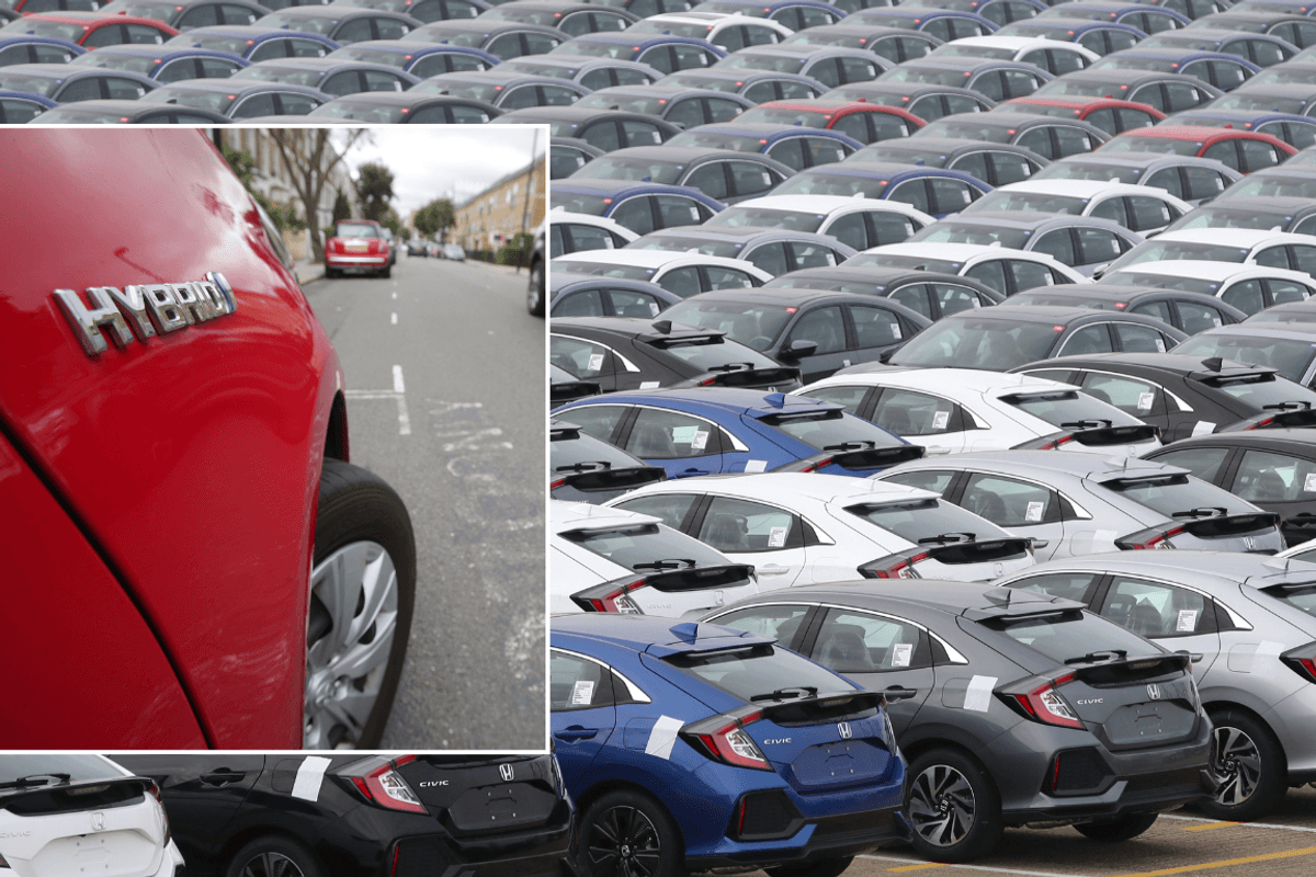 Hybrid car and Honda vehicles parked