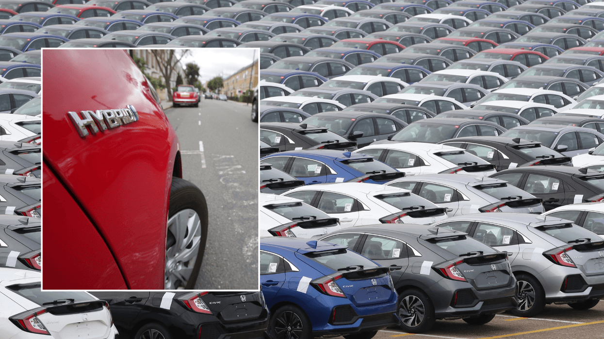 Hybrid car and Honda vehicles parked