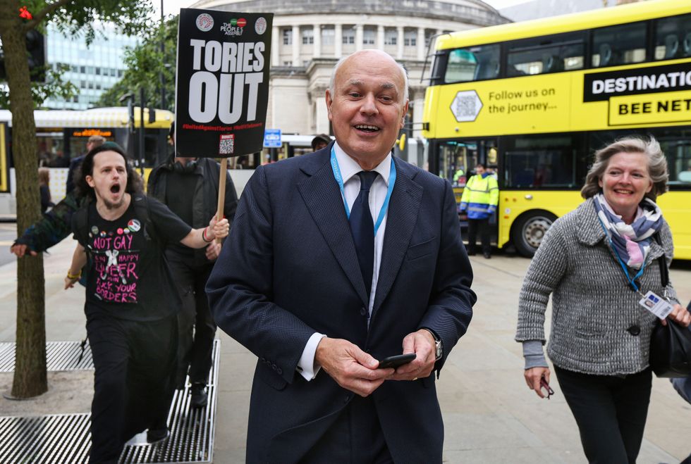 Iain Duncan Smith, Member of Parliament leaves after the Conservative conference.