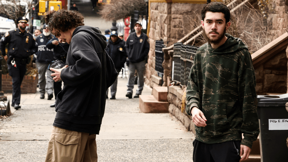 Ibraham Kayumi, 19, and Emir Balat, 18 on the streets of NYC - with the IED in hand
